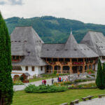 Wooden buildings in the courtyard of Barsana Monastery, Maramures, Romania